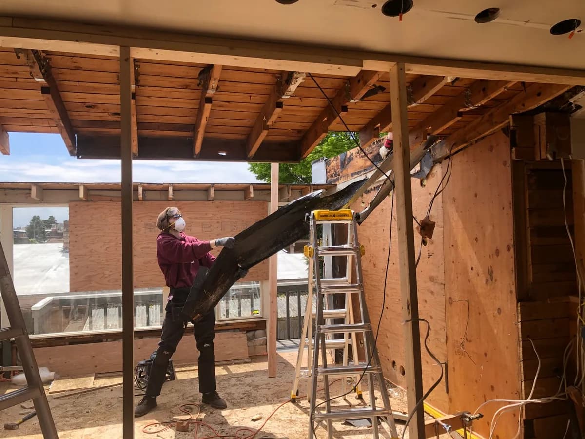 Remodeling contractor working inside a residential renovation